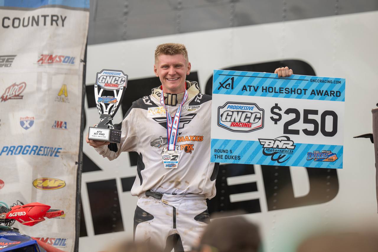 Rider on podium with second place trophy